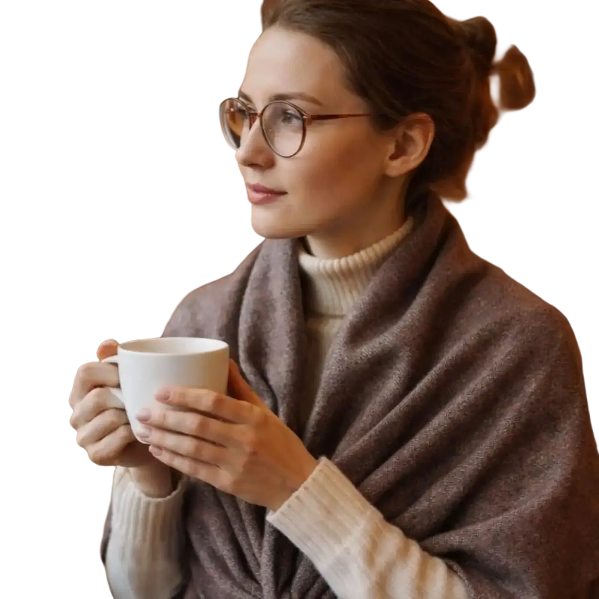 White ceramic coffee cup held in hands with a women winter triangle knit scarf shawl in soft warm fabric