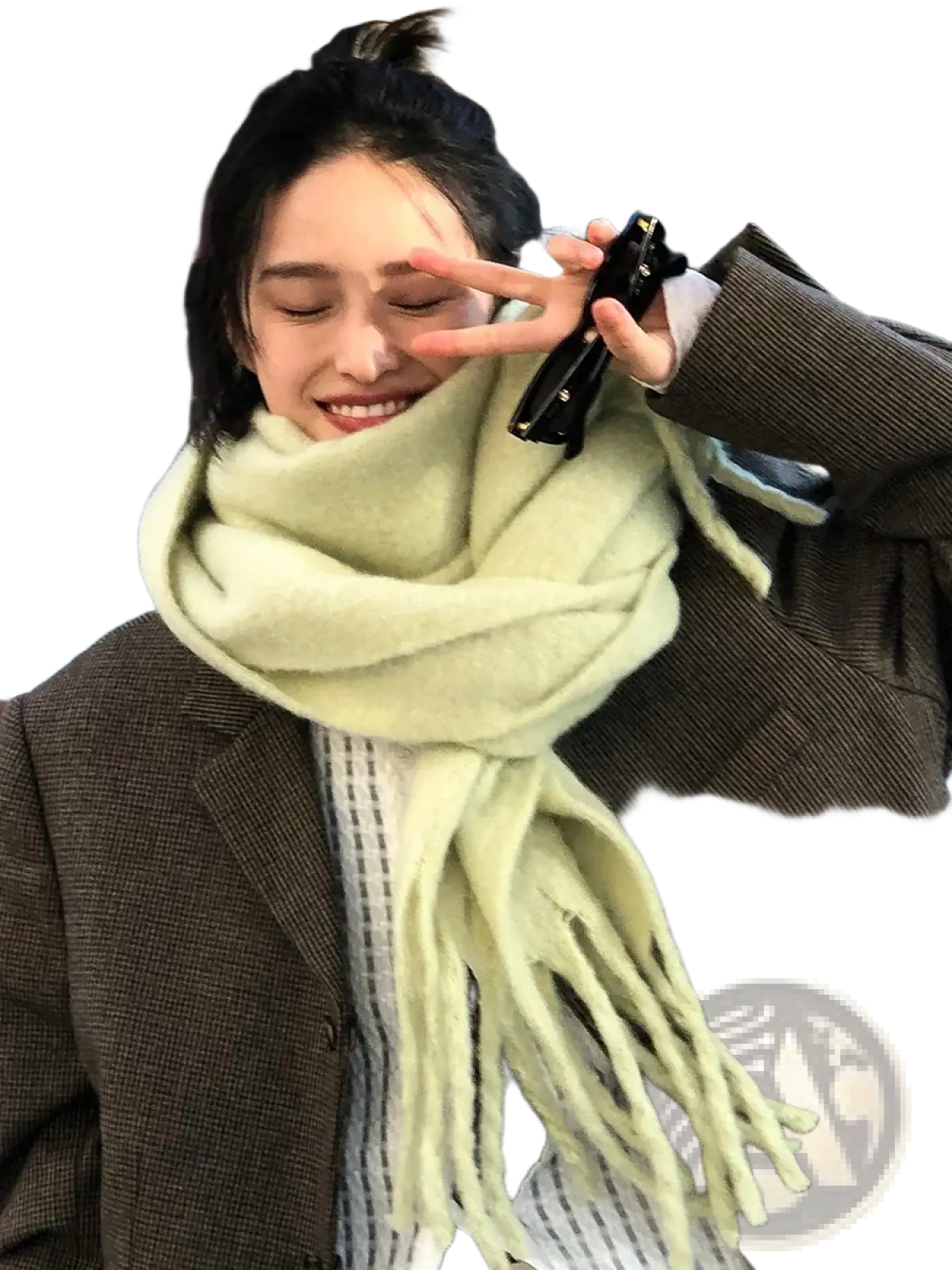 A soft light green woolen pashmina scarf with fringed ends for women winter warmth and solid color style