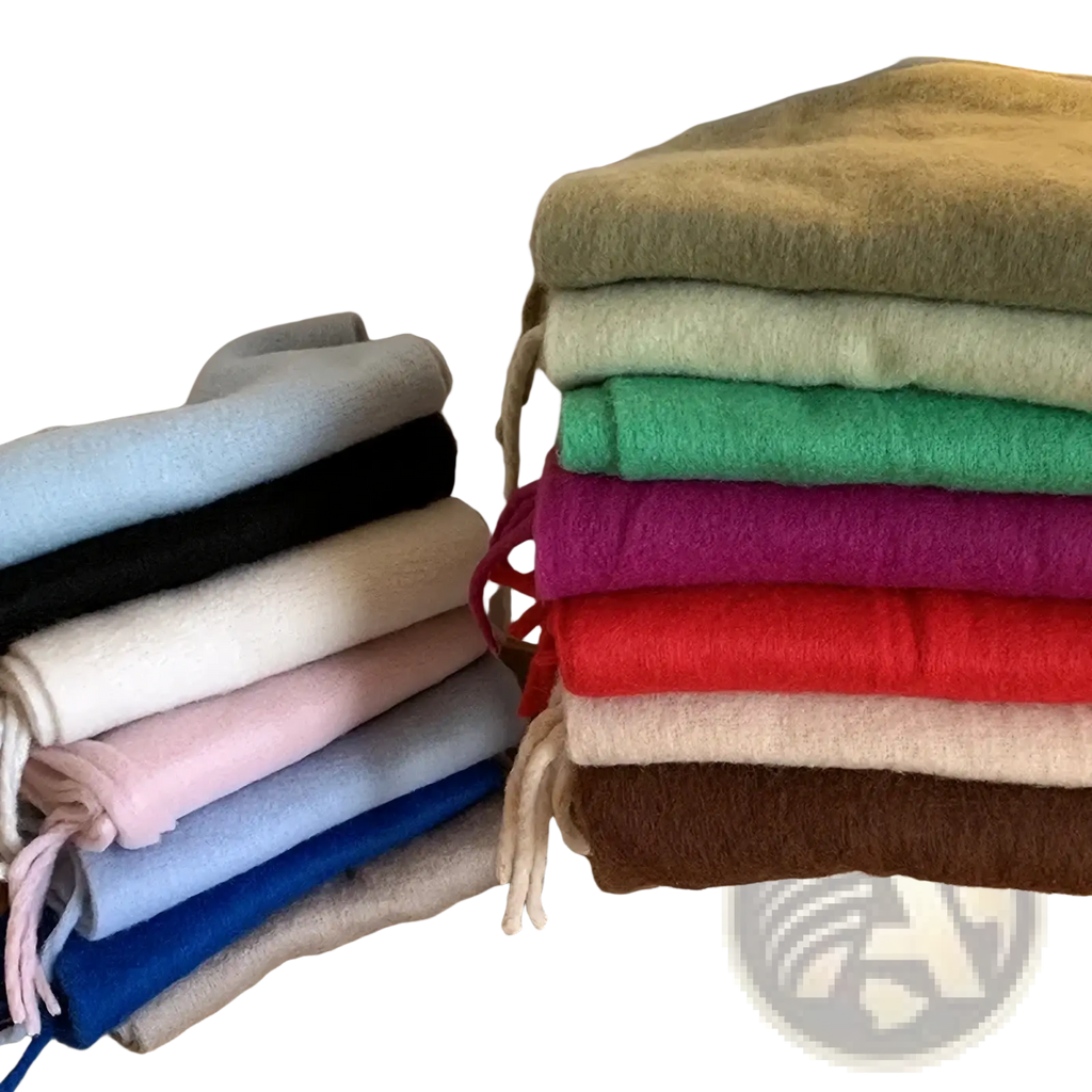 Stack of colorful soft felt women winter warm solid color pashmina shawl scarves in earthy and pastel tones