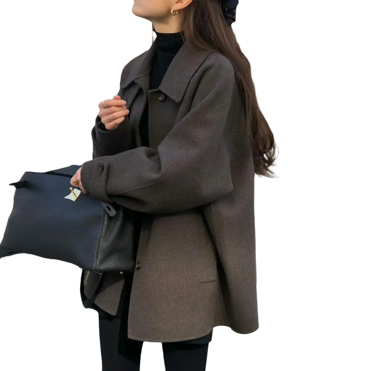 Black leather handbag with gold-tone logo tag paired with a women woolen coat elegant lapel mid-length design
