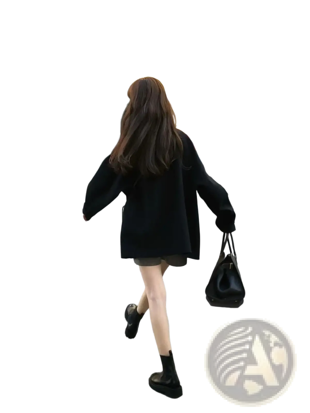 Black leather handbag with structured shape and top handle paired with women woolen coat elegant lapel mid-length
