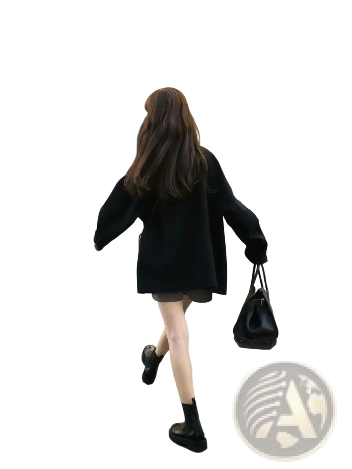 Black leather handbag with structured shape and top handle paired with women woolen coat elegant lapel mid-length
