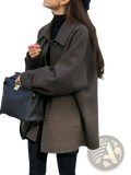 Dark gray woolen mid-length women coat with elegant structured collar and button closures