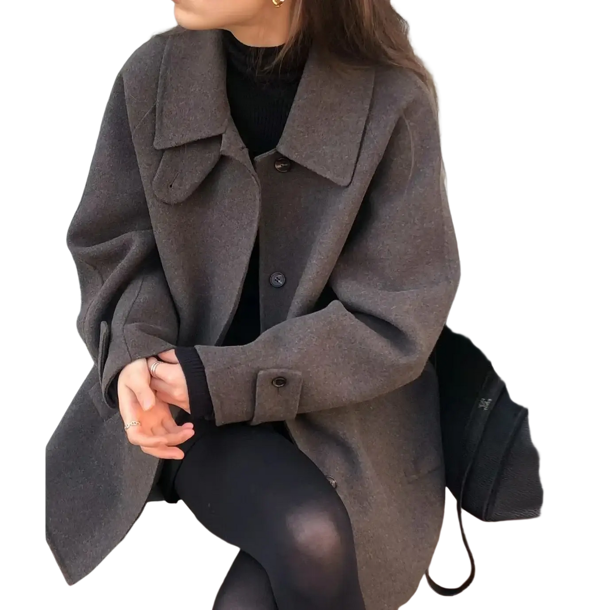 A cozy oversized gray woolen coat for women with a classic collar and buttoned cuffs mid-length design