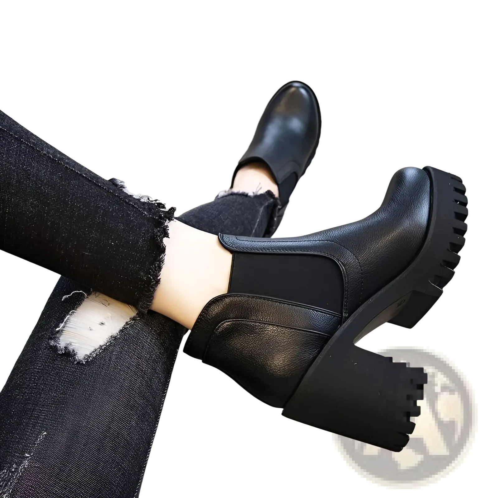 Women’s black leather ankle boots with chunky heel and textured rubber sole shown from the back side