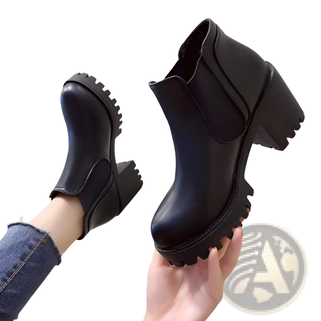 Women’s black leather chunky heel ankle boots with elastic side panels and textured chunky soles
