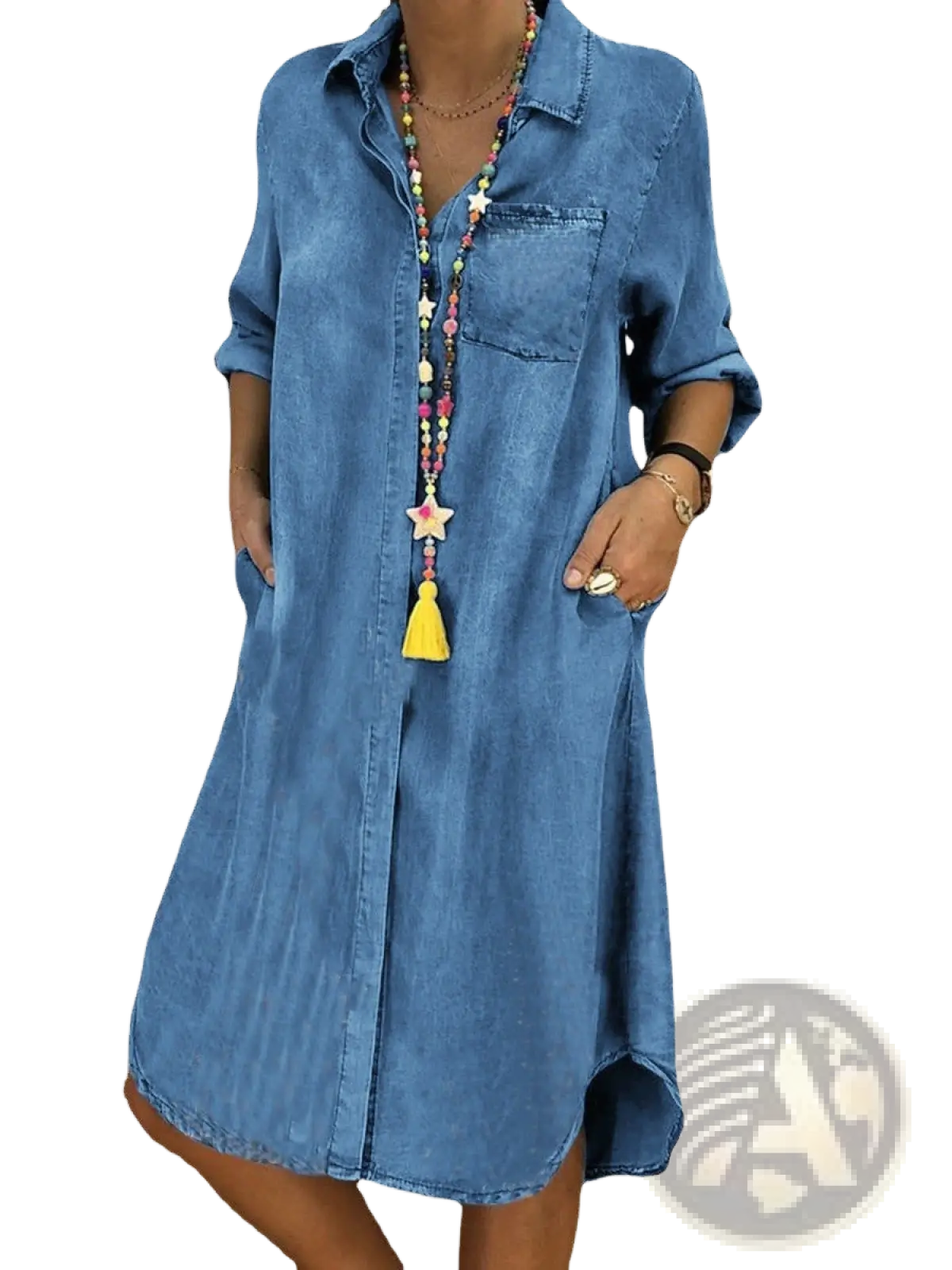 A women’s medium-wash denim shirt dress with rolled-up sleeves and front button closure