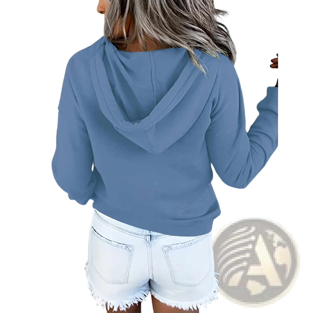 Women’s soft blue long-sleeved button neck drawstring hooded sweatshirt with relaxed fit and cozy material