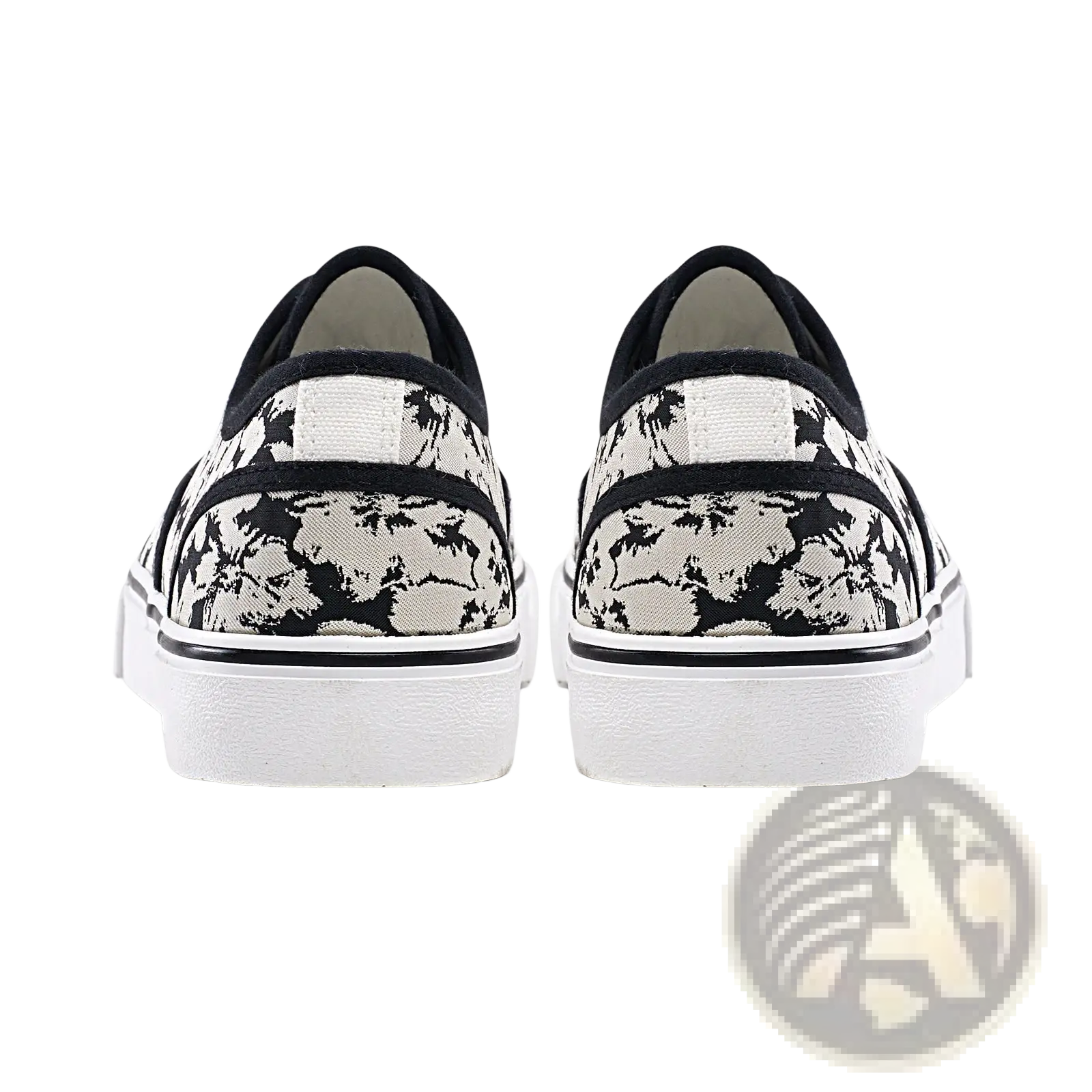 Women’s canvas lace up low top casual sneakers with black and white floral pattern and textured rubber sole