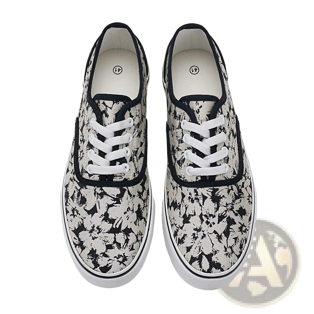 Women’s canvas lace up low top casual sneakers in black and white floral pattern with contrasting black trim