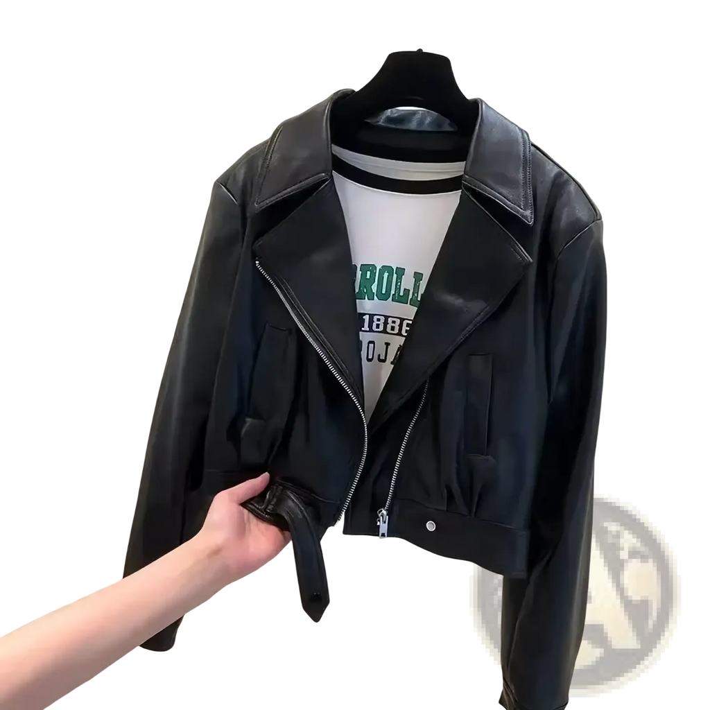Black cropped faux leather moto jacket for women with adjustable waist tie shown from the back side