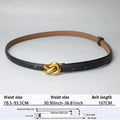 Women’s designer leather belt in black with a gold-tone knotted buckle for stylish accessorizing