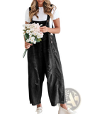 Women’s distressed black denim overalls with button closures and adjustable straps made of durable denim material