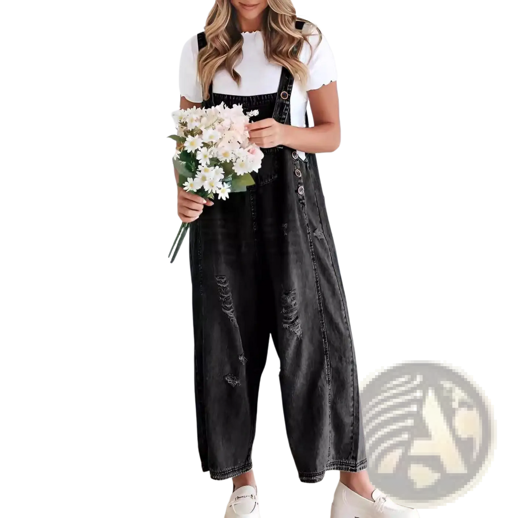Black distressed denim overalls with adjustable straps and button closures for women in a casual style