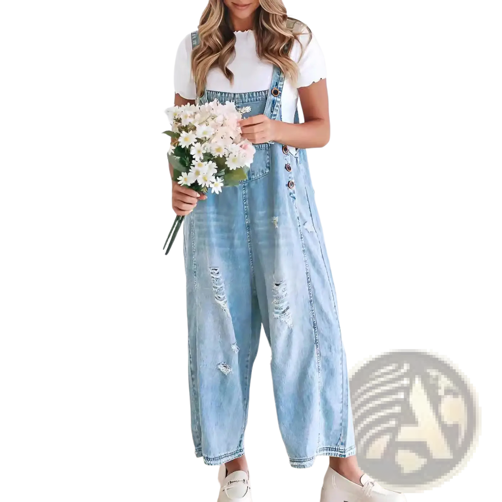 Women’s light-wash denim overalls with distressed patches and button closures featuring adjustable straps