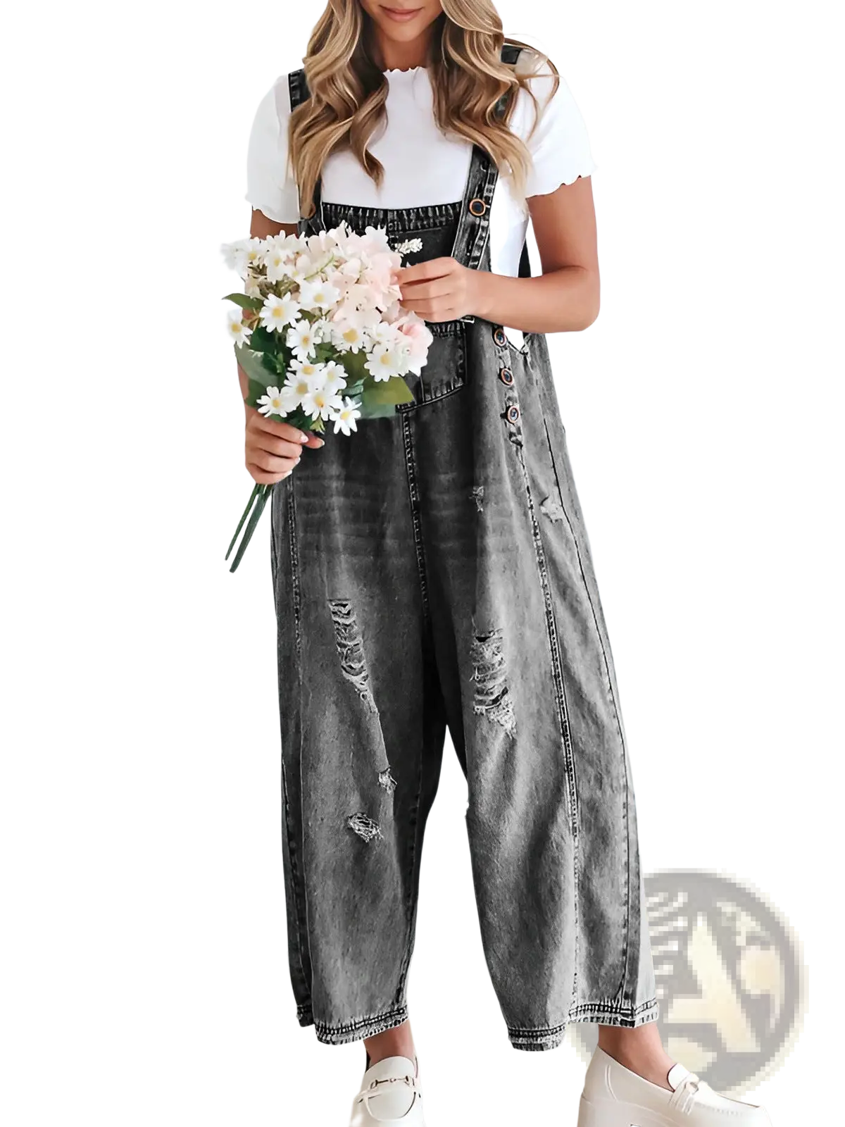 Women’s black denim overalls with distressed patches and button closures featuring adjustable straps