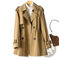 Beige women’s double breasted trench coat with adjustable cuffs made from lightweight fabric for stylish outerwear