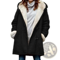 Women’s black fleece lined hooded toggle parka jacket with shearling lining and toggle closures for cold weather