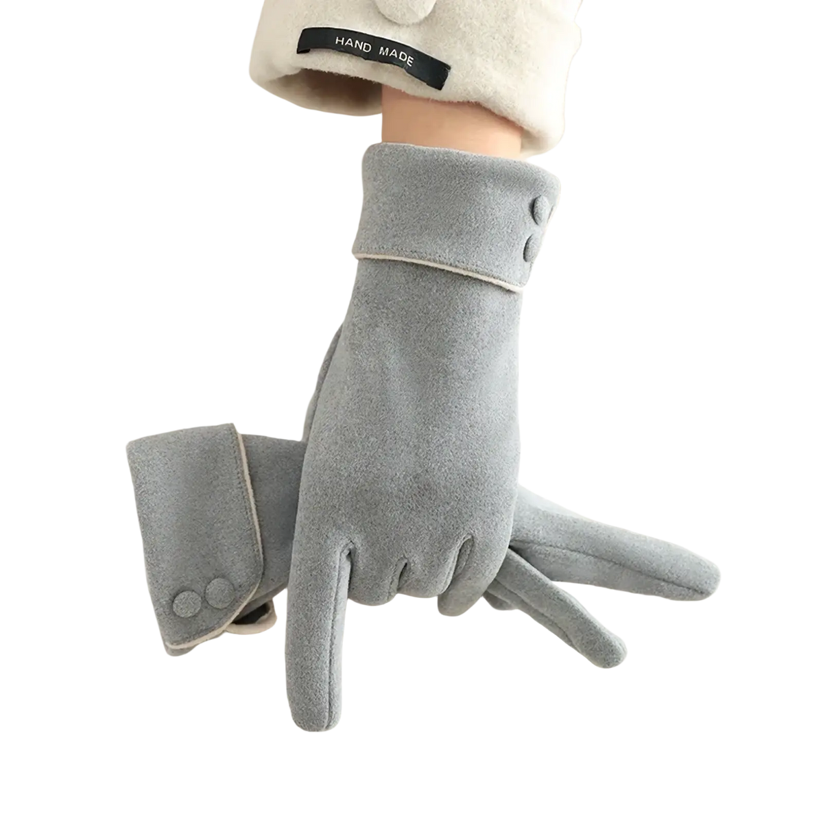 Women’s fleece lined warm winter gray suede gloves with buttoned cuffs worn over a cream-colored coat