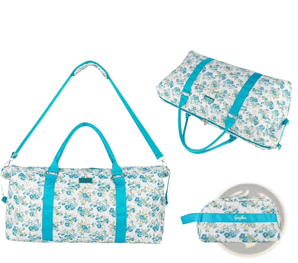 A teal and white floral patterned women’s travel duffel bag with matching straps and toiletry pouch