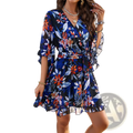 Women’s floral v-neck ruffle wrap dress in vibrant blue with orange white blossoms and waist tie detailing