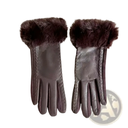 Women’s brown leather winter gloves with plush dark fur trim at the wrist for warmth and style