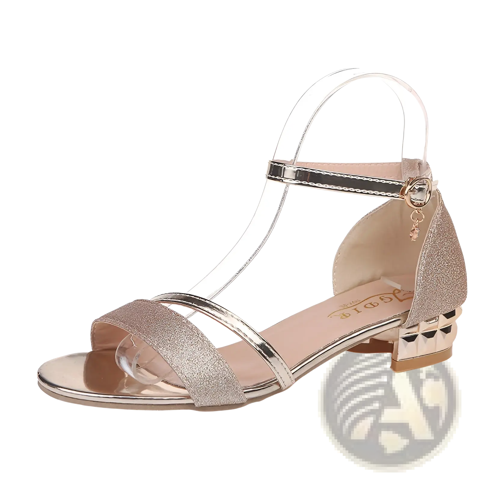 Glittery rose gold women’s low heel buckle sandal with clear straps and a metallic heel for elegant wear