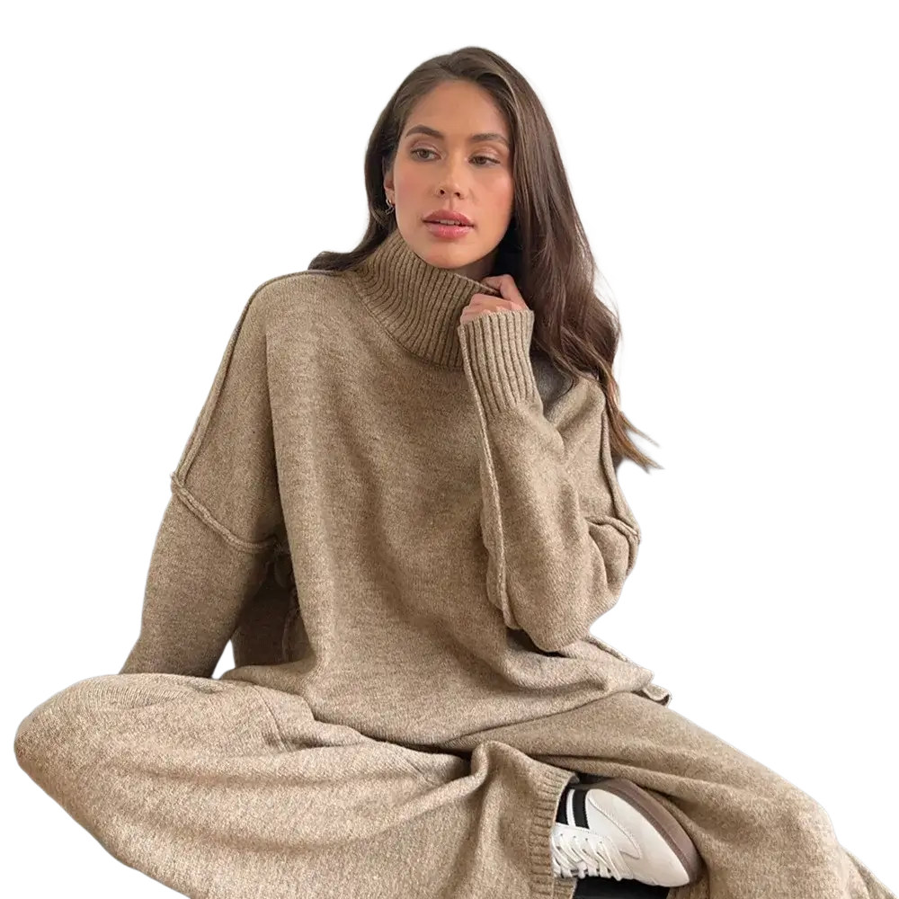 Beige oversized knit two piece sweater set with turtleneck and ribbed cuffs consisting of a sweater and matching pants