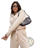 Black crocodile-textured shoulder bag with silver chain strap paired with women’s knit zip up cardigan and wide leg pant set