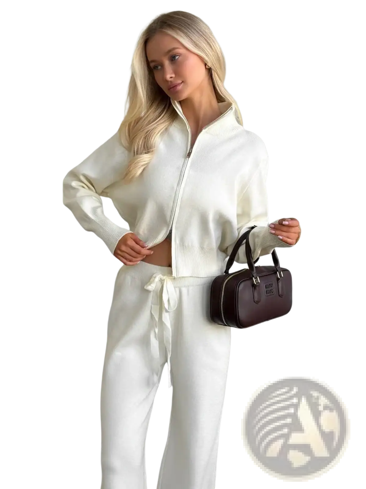 A sleek dark brown leather handbag with structured shape and black handles paired with women’s knit zip up cardigan set