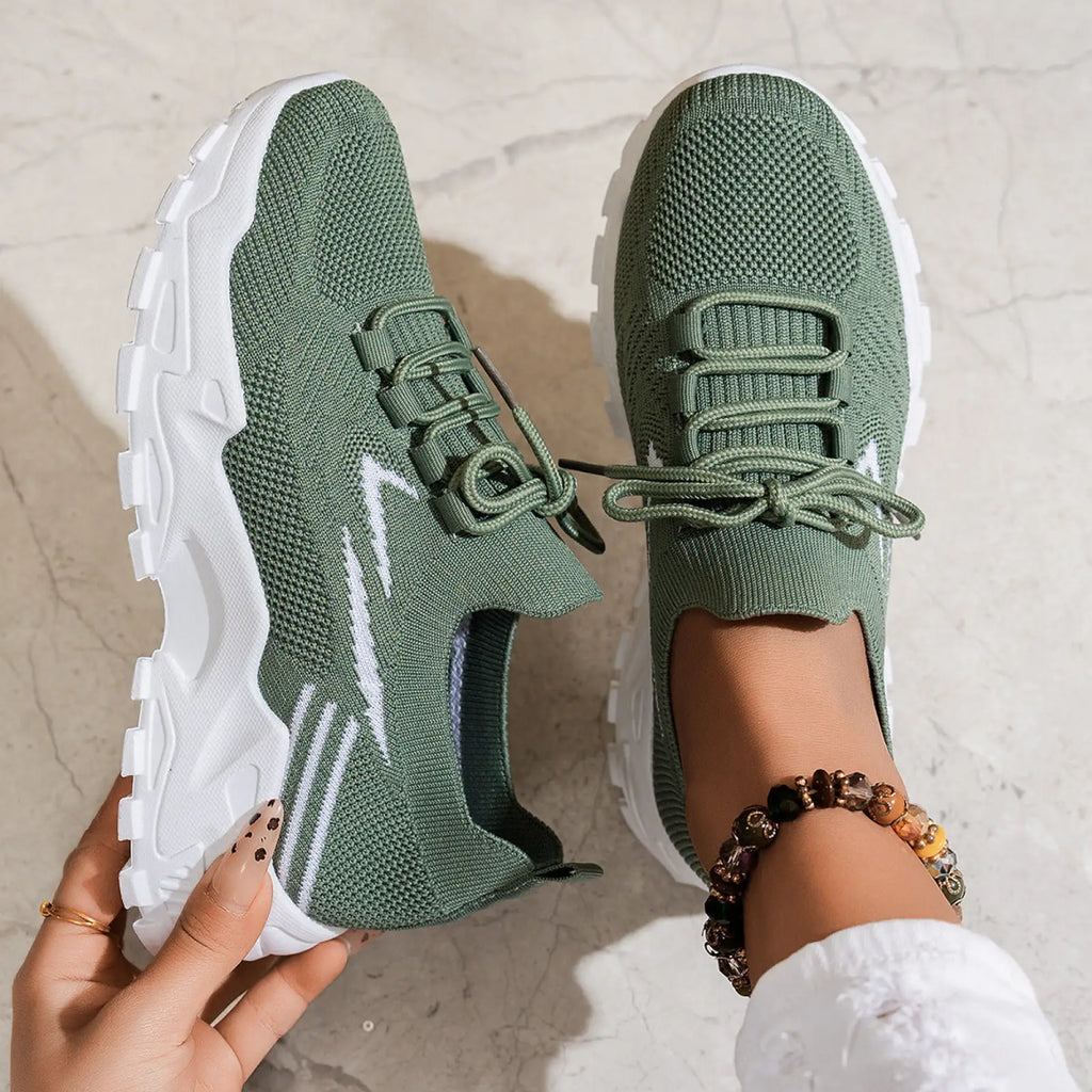 Olive green women’s lightweight breathable mesh knit sneakers with white rubber soles and side stripes for sports use