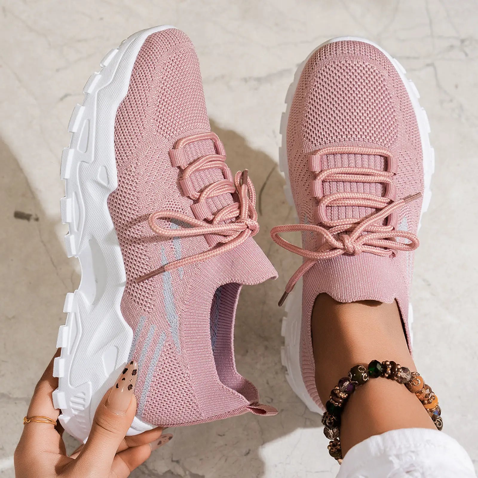 Pink knit women’s lightweight breathable mesh lace up sports shoes with white chunky soles and matching laces
