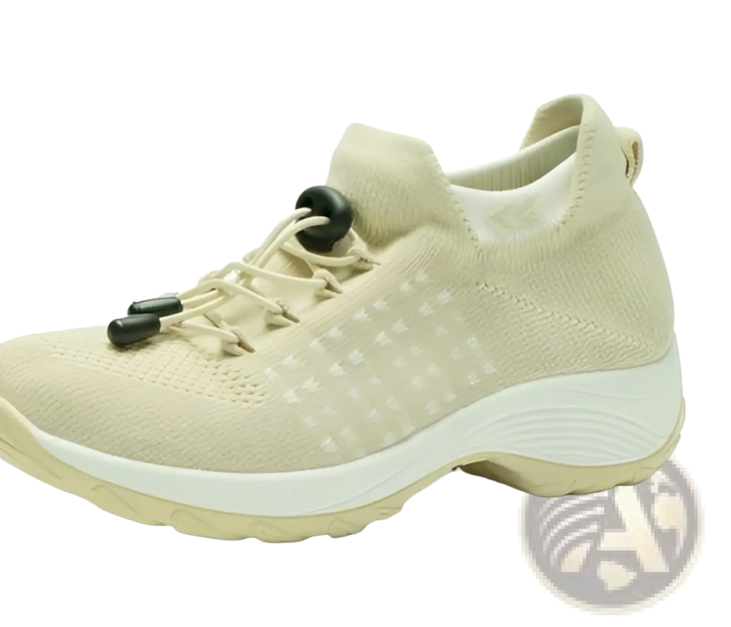 Beige knit women’s lightweight fly knit casual sneaker with black lace-tighteners and white rubber sole