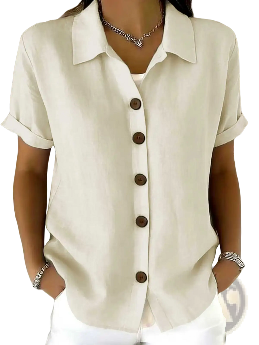 Cream-colored women’s linen blend short sleeve shirt with rolled cuffs and dark brown buttons