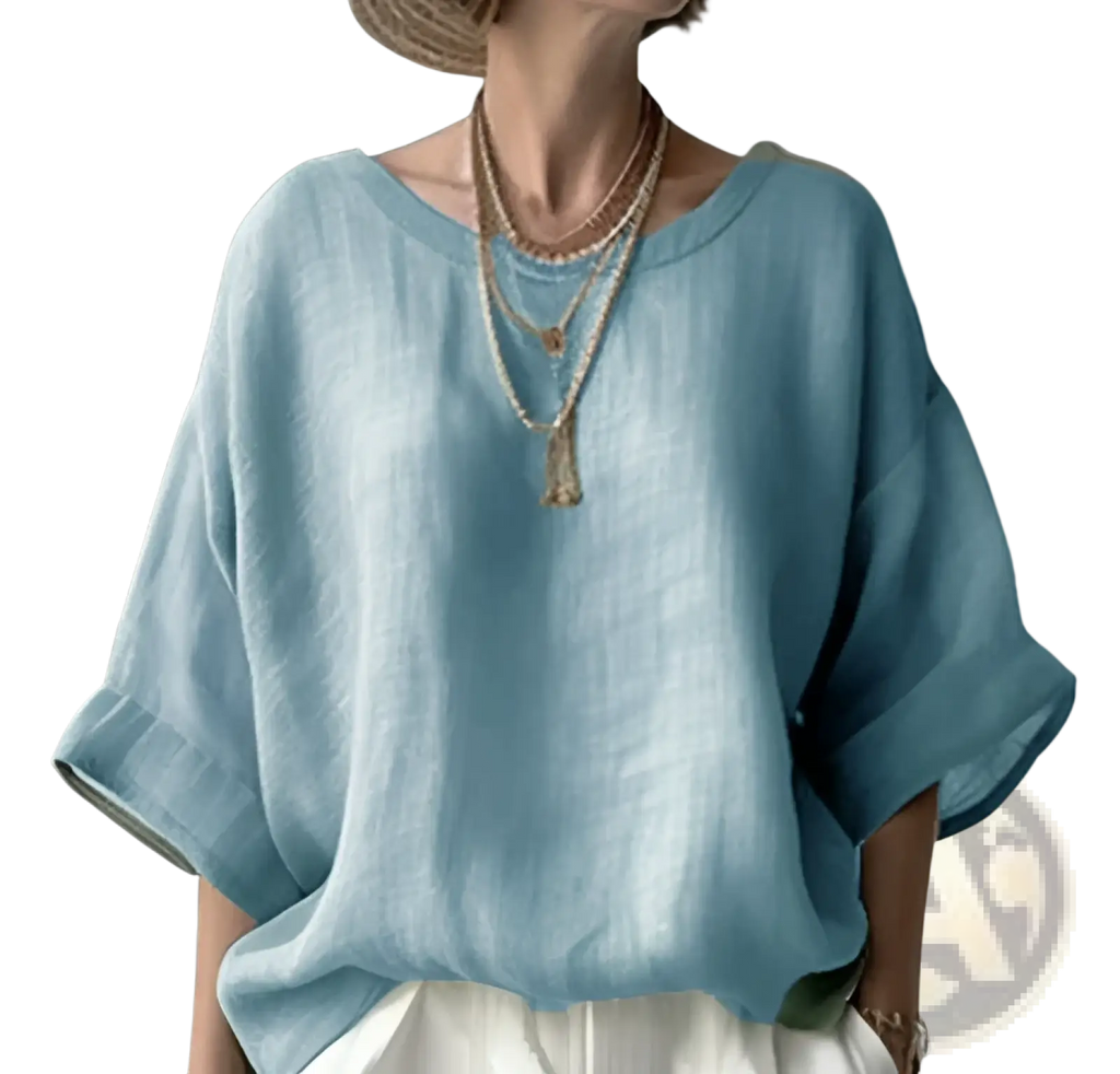 Women’s loose linen drop shoulder blouse in light blue with wide sleeves and relaxed fit made from breathable linen