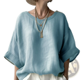 Women’s loose linen drop shoulder blouse in light blue with wide sleeves and relaxed fit made from breathable linen