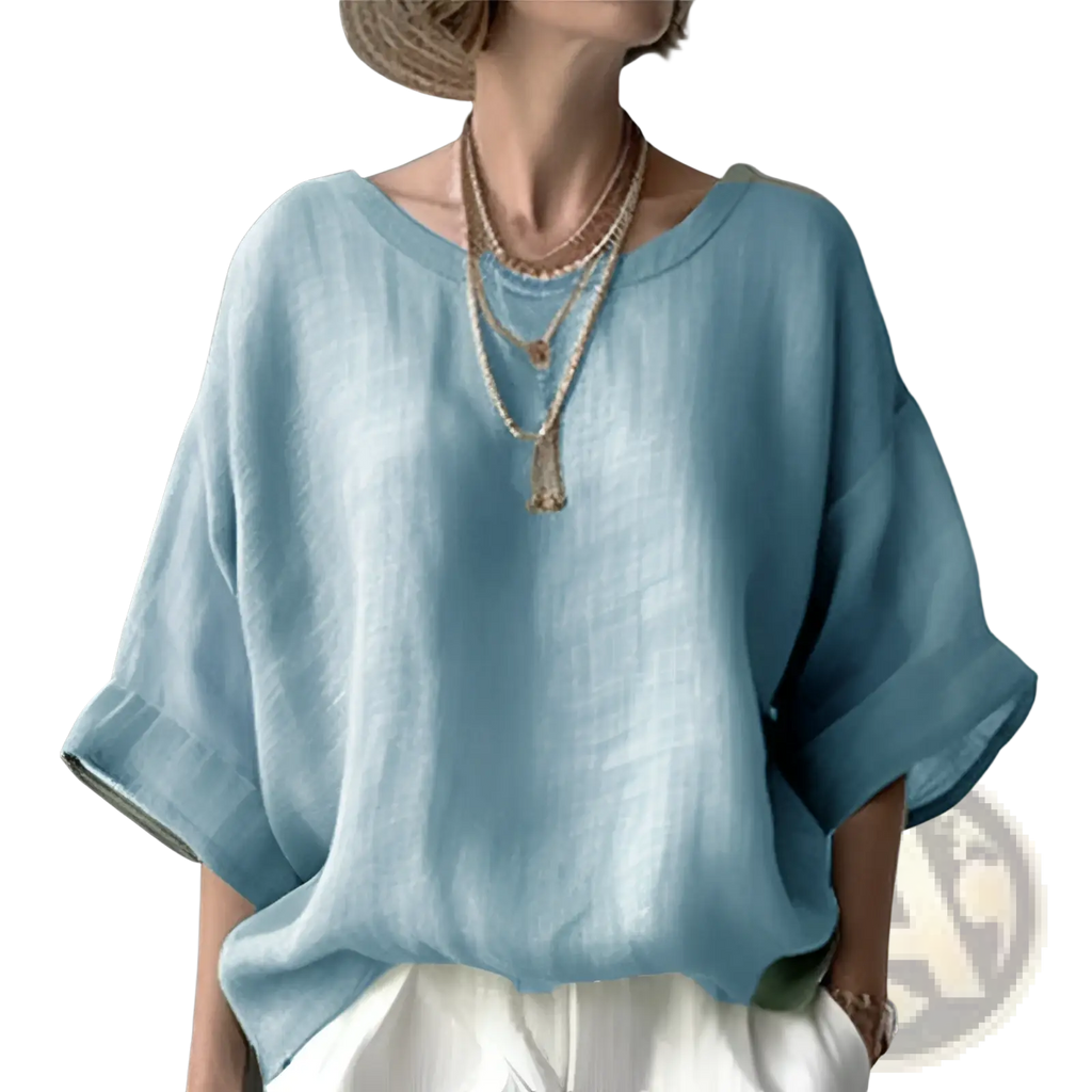 Women’s loose linen drop shoulder blouse in light blue with wide sleeves and a relaxed fit
