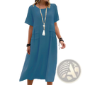 A flowing blue linen women’s loose short sleeve midi beach dress with subtle side pockets and relaxed fit