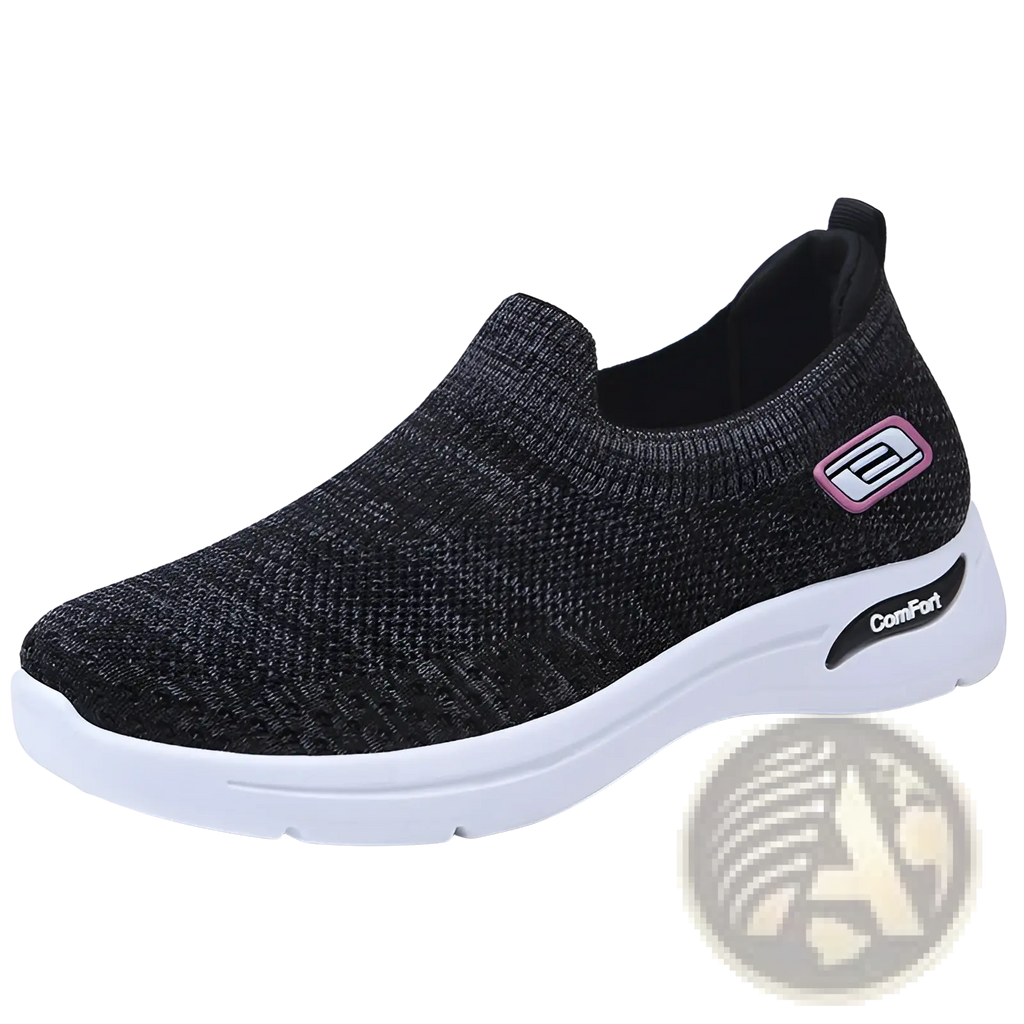 Black mesh knit slip-on women’s sneaker with white rubber sole and pink-accented logo for comfort wear