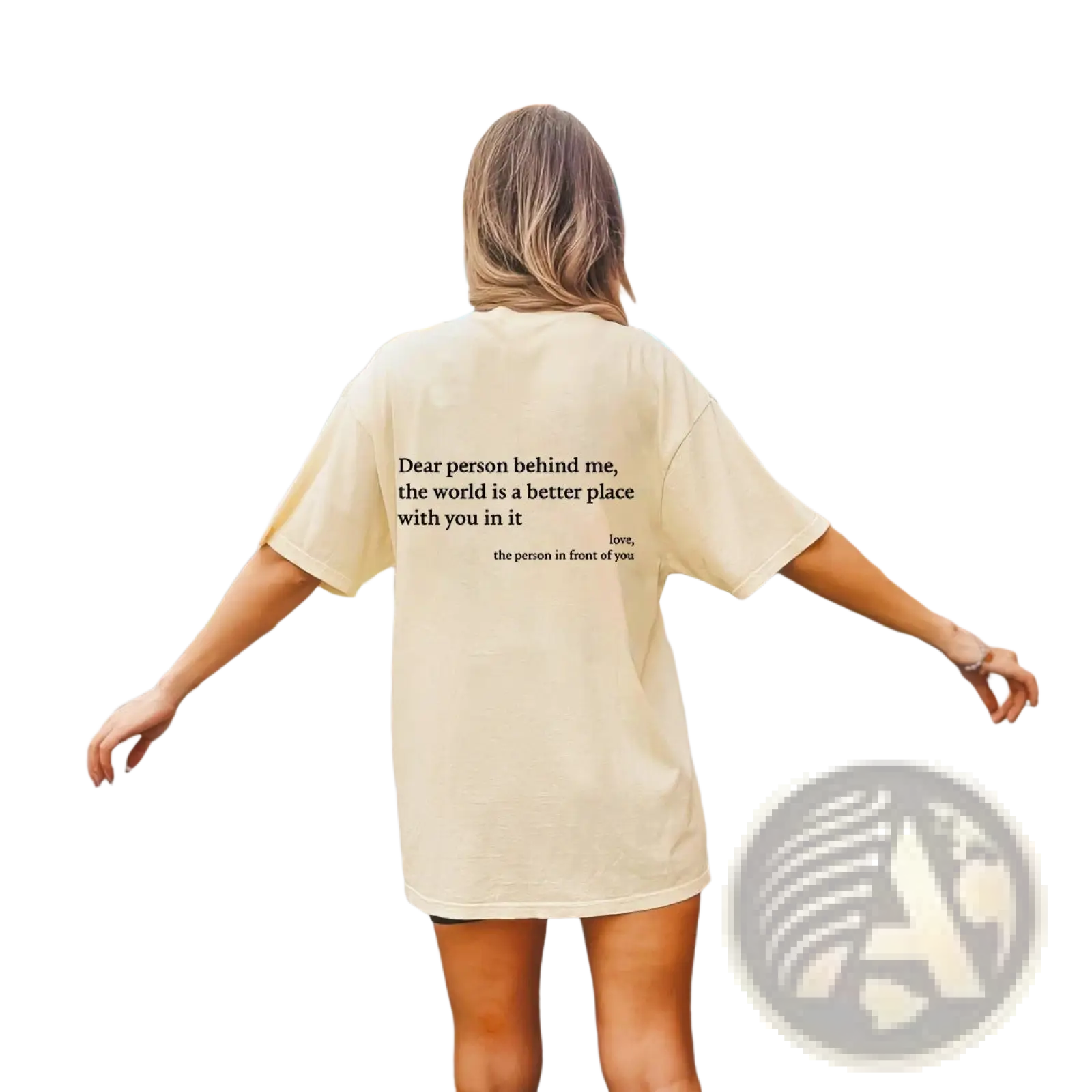 Back view of a cream-colored women’s oversized cotton t-shirt with a black slogan print graphic