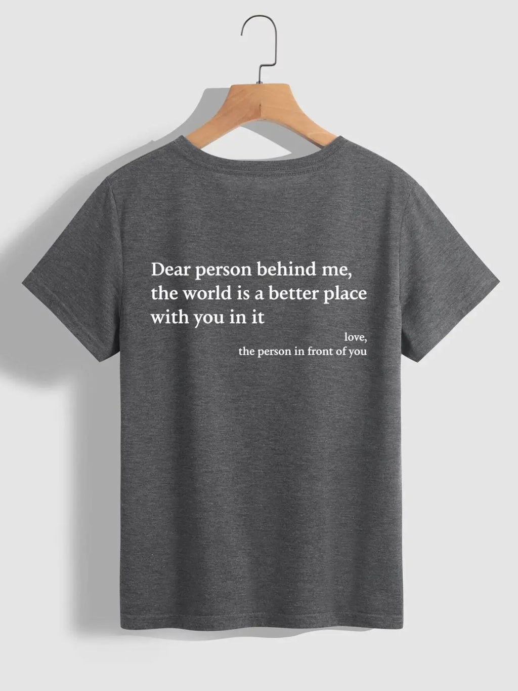 Back view of women’s oversized slogan print graphic t-shirt in dark gray heathered cotton with white printed text
