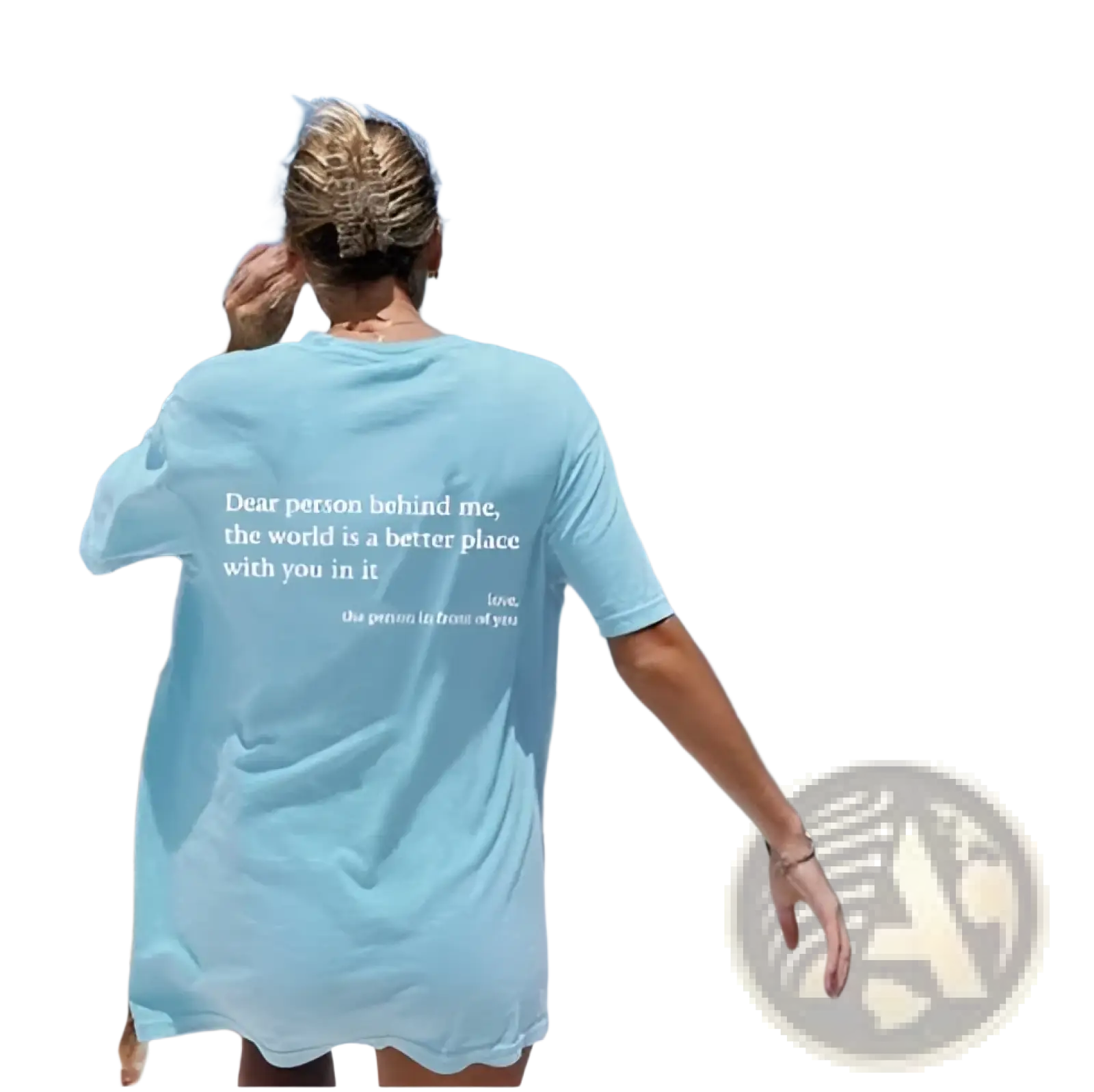 Back side of a women’s light blue oversized cotton t-shirt with white slogan print on the back