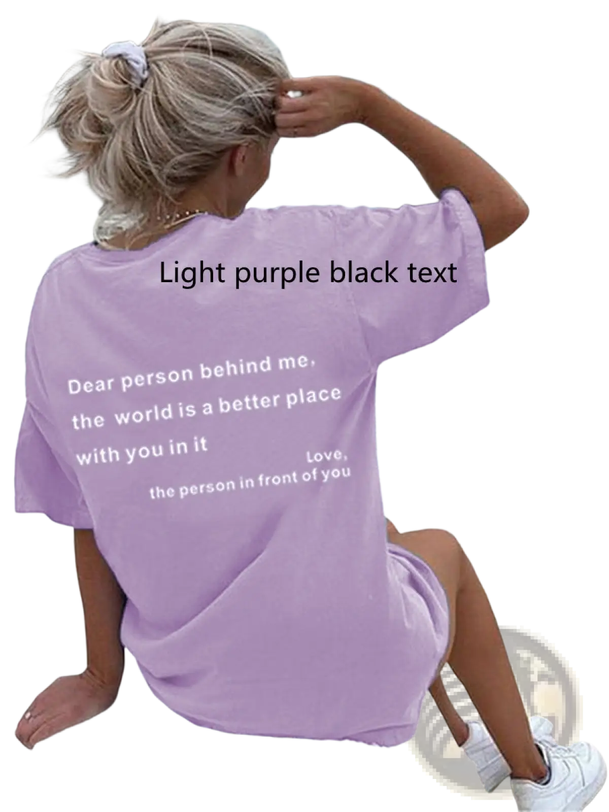 Women’s oversized light purple t-shirt with black slogan print on back made of soft breathable fabric