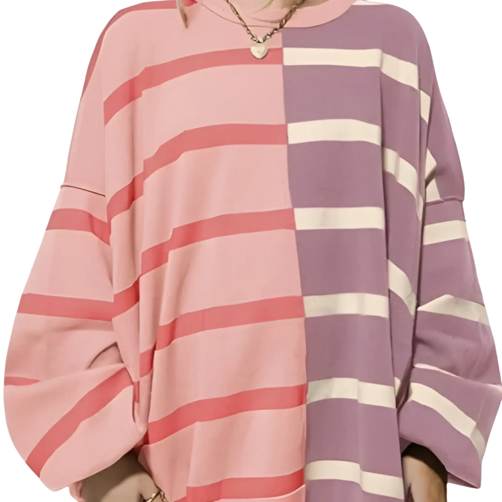 Women’s oversized knit sweater with split design featuring pink and purple horizontal stripes on each side