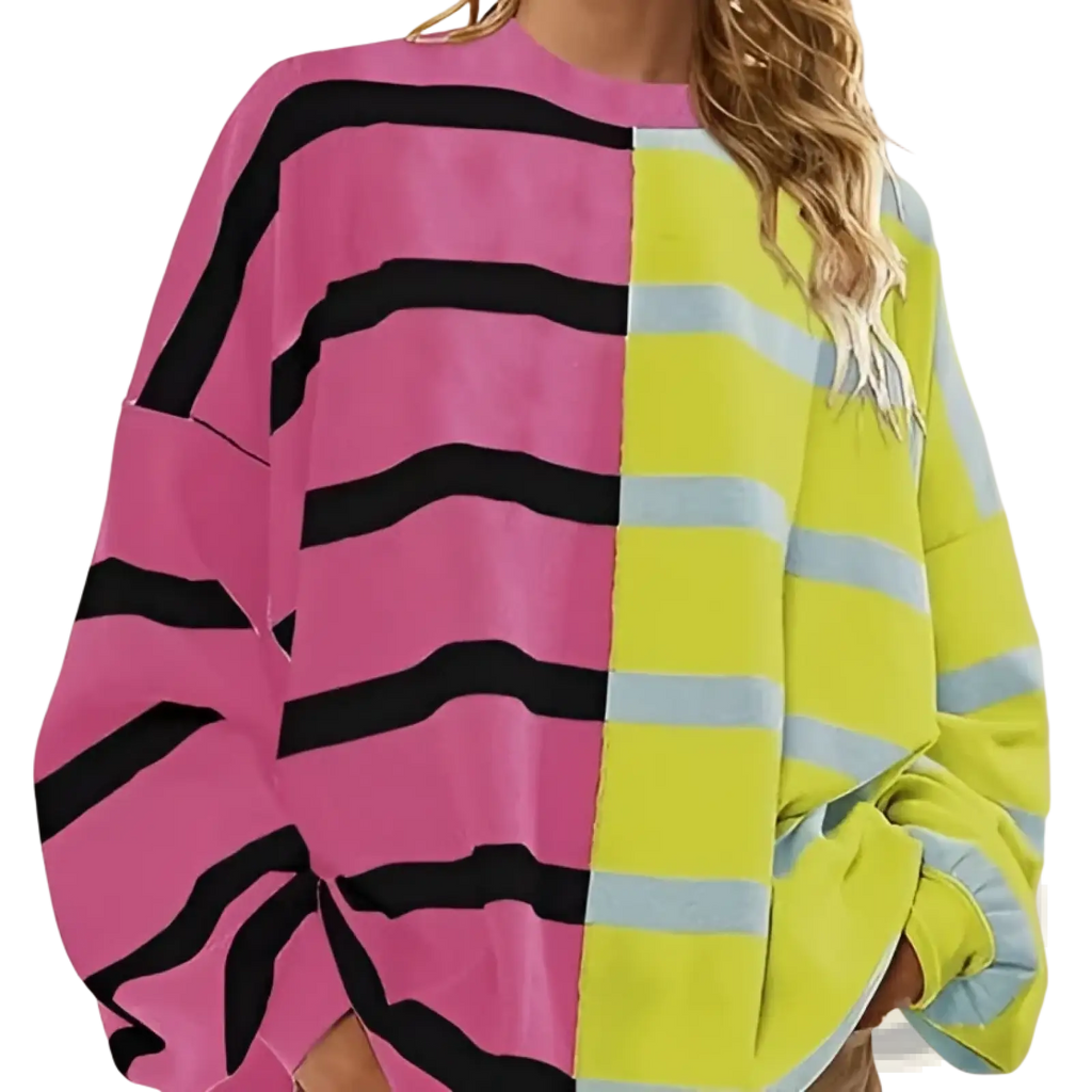 A women’s oversized knit sweater with a bold split design in pink black and neon yellow light blue stripes