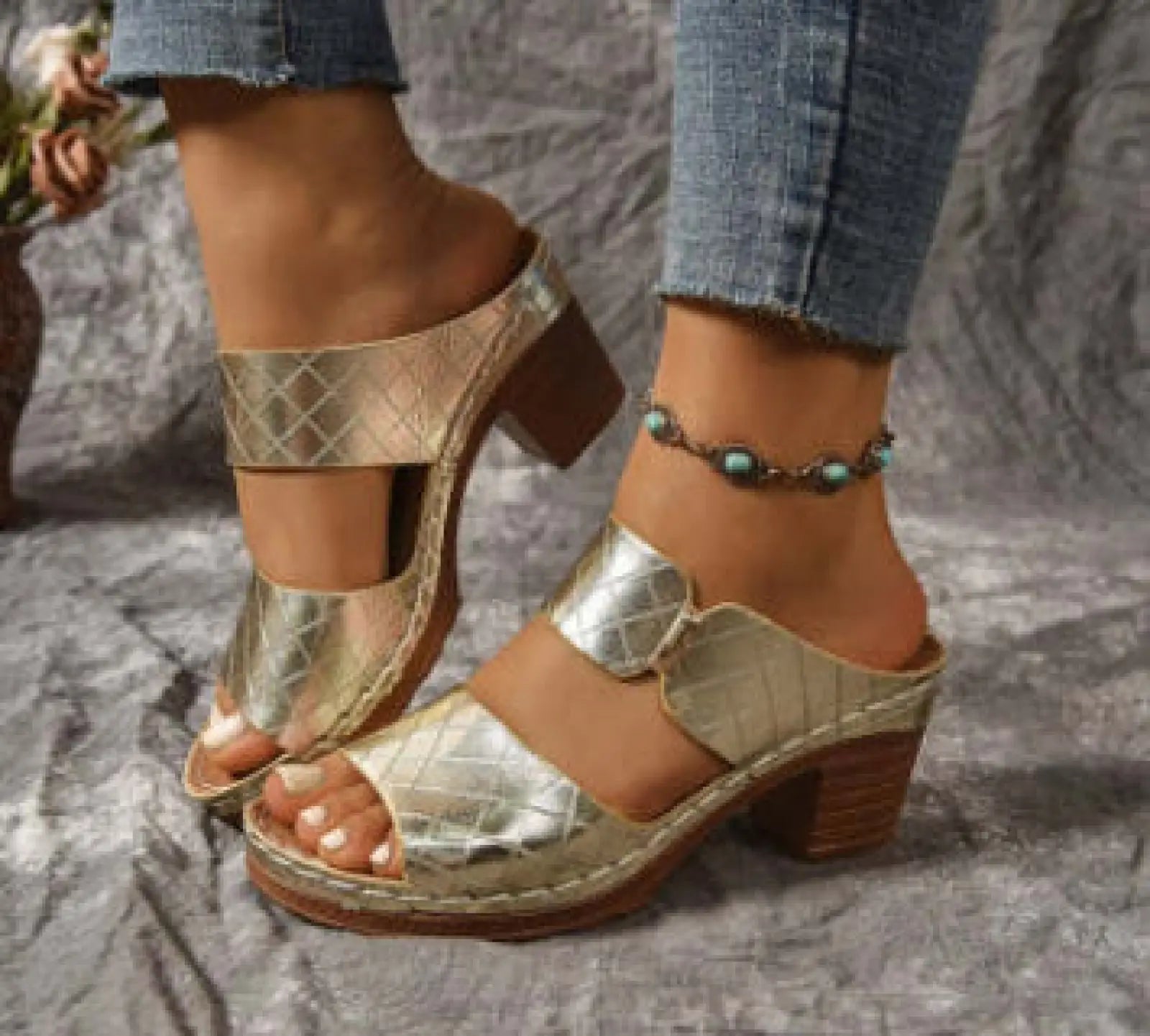 Women’s gold quilted leather mule sandals with chunky wooden heel and round toe design