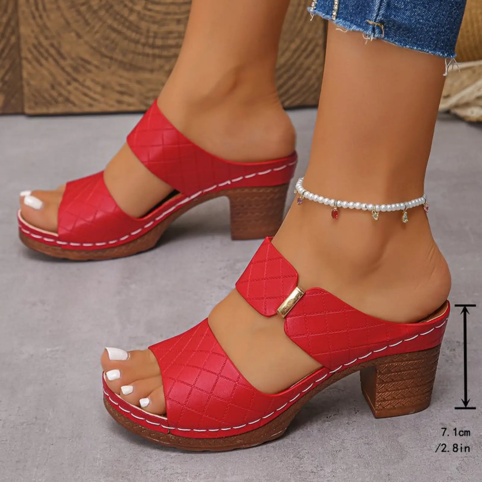 Women’s red leather quilted mule sandals with wooden block heel and white stitching for stylish comfort