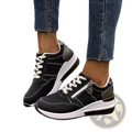 Women’s black and white synthetic leather platform sneakers with side zipper for casual wear