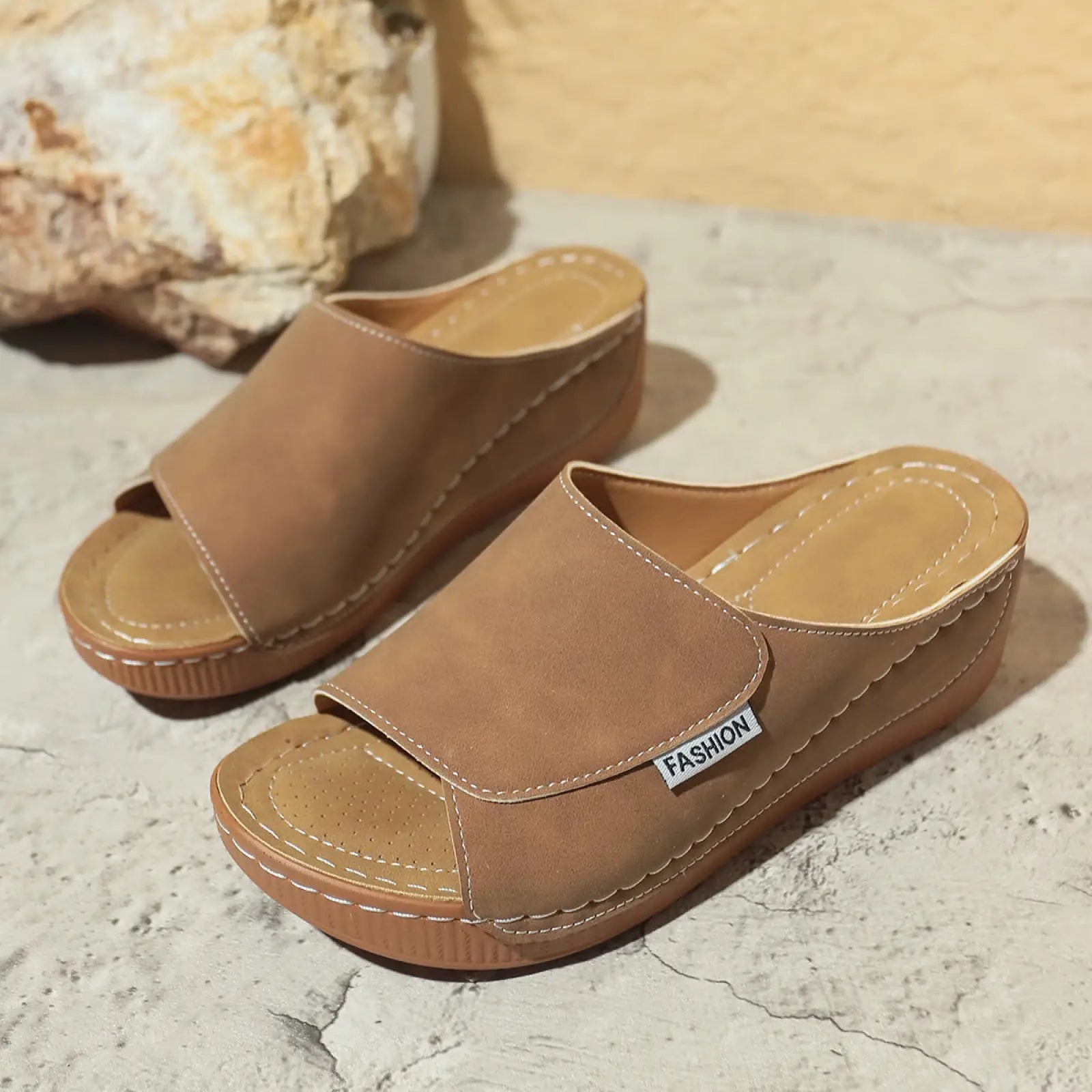 Women’s tan suede platform wedge summer slide sandals with fashion label on the strap