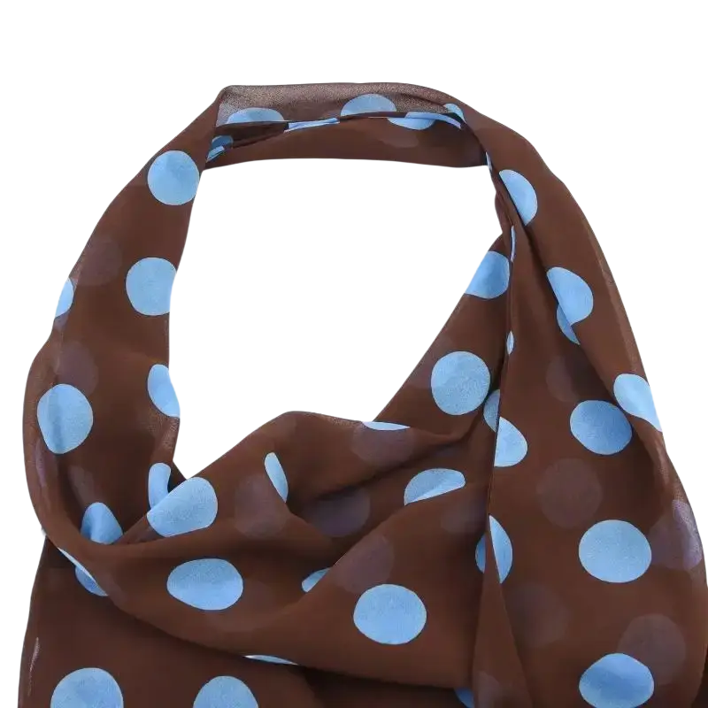 Brown sheer scarf with light blue polka dots complements women’s polka-dot midi skirt set in selected size
